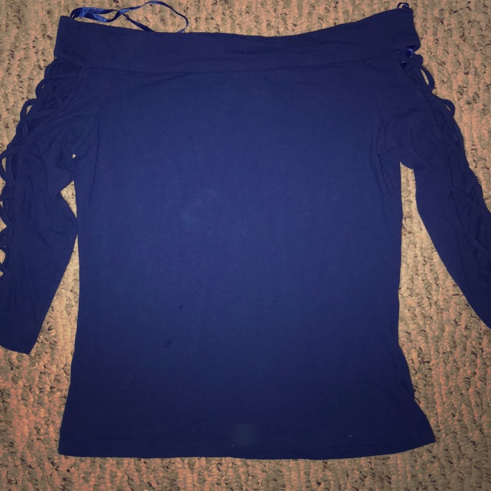 A blue of the shoulder shirt